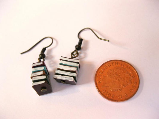 A Pile Of Book Earrings In The Retro Library
