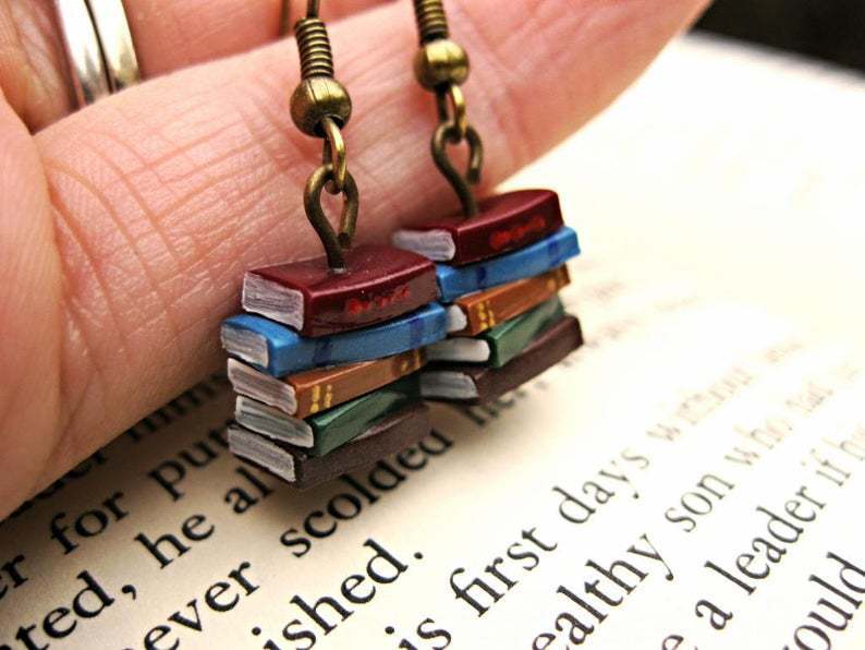 A Pile Of Book Earrings In The Retro Library
