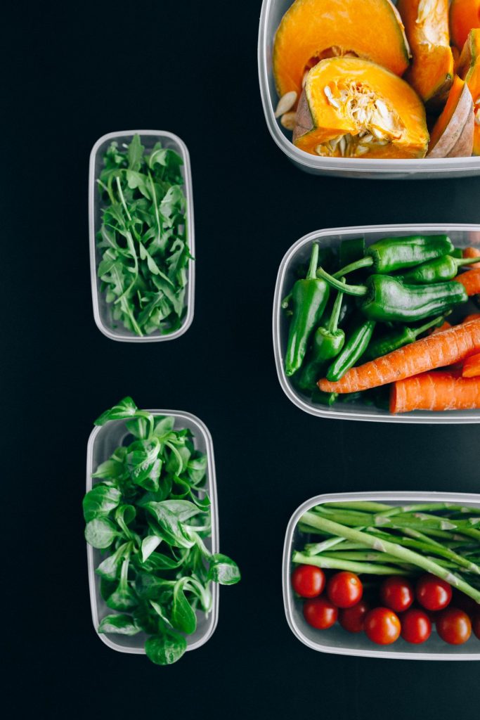 Fresh vegetables stored in clear containers